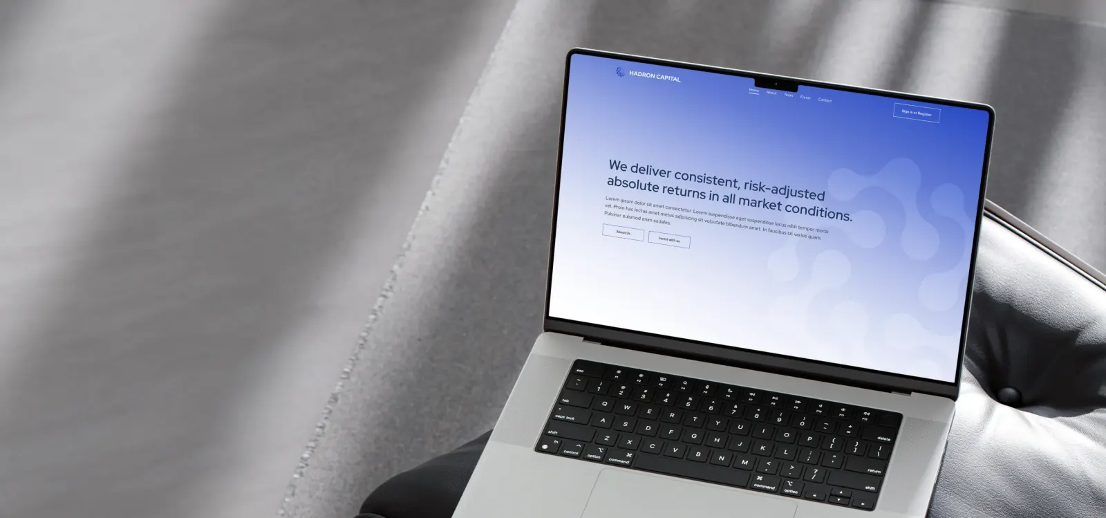 Hadron Capital website on laptop